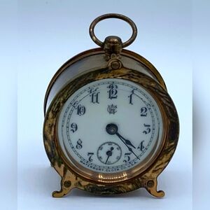 ANTIQUE 1891 SMALL WATERBURY WINDUP CLOCK. CRACKED ON BOTTOM l.